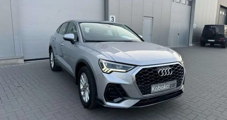 Photo 1 : Audi Q3 2020 Hybride